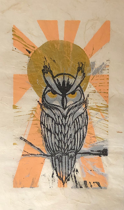 owl with sun behind